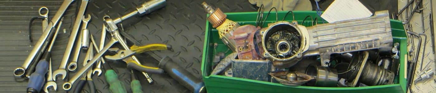 Green box containing repair tools